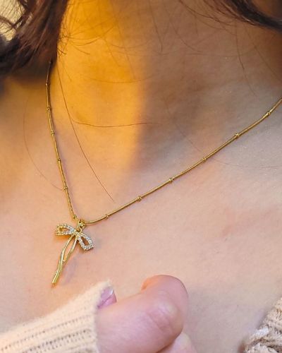 Long Bow Pendant Necklace