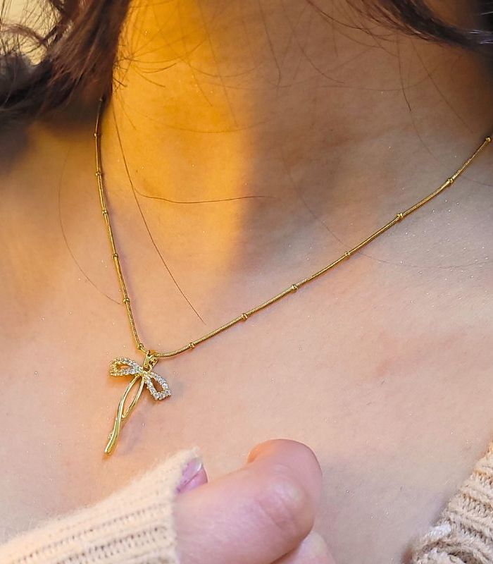 Long Bow Pendant Necklace