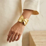 Aurielle Cascade cuff bracelet for women, Gold cuff bracelet India, Anti tarnish gold cuff bracelet, Minimal gold bracelet for women, AMOHABOLD cuff bracelet, Gold plated oval bracelet, Everyday gold cuff jewellery, Office wear gold bracelet, Modern cuff bracelet for women, Luxury look gold bracelet