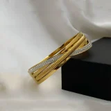 crisscross crystal bracelet for women, Gold crystal bracelet India, Crisscross gold bracelet, AMOHABOLD crystal bracelet, Gold plated rhinestone bracelet, Elegant gold bracelet for women, Anti tarnish crystal bracelet, Minimal party wear bracelet, Office wear gold bracelet, Luxury look crystal jewellery
