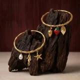 Marina ocean charm bracelet for women, Beach charm bracelet gold, Gold charm bracelet online India, AMOHABOLD ocean bracelet, Summer jewellery bracelet for women, Vacation inspired gold bracelet, Anti tarnish charm bracelet, Coastal jewellery for women, Trendy charm bracelet, Gold plated beach bracelet